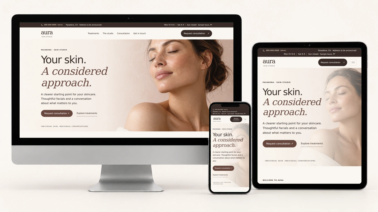 Aura Skin Studio on a silver desktop, portrait tablet, and phone, with actual responsive page screenshots