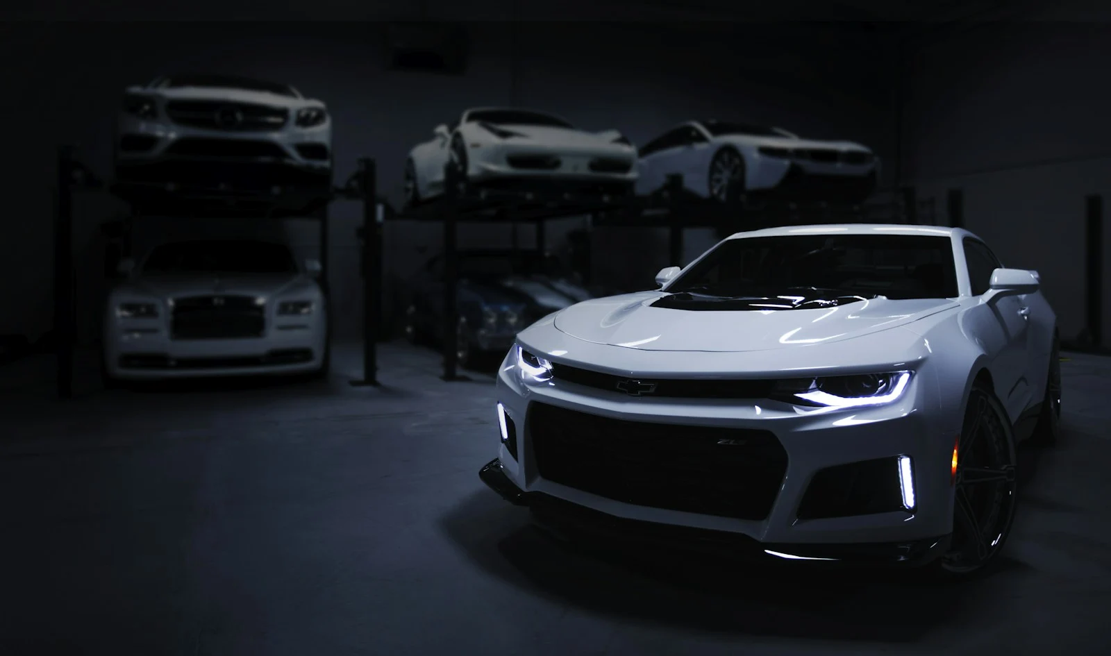 Silver performance coupe at an automotive showroom