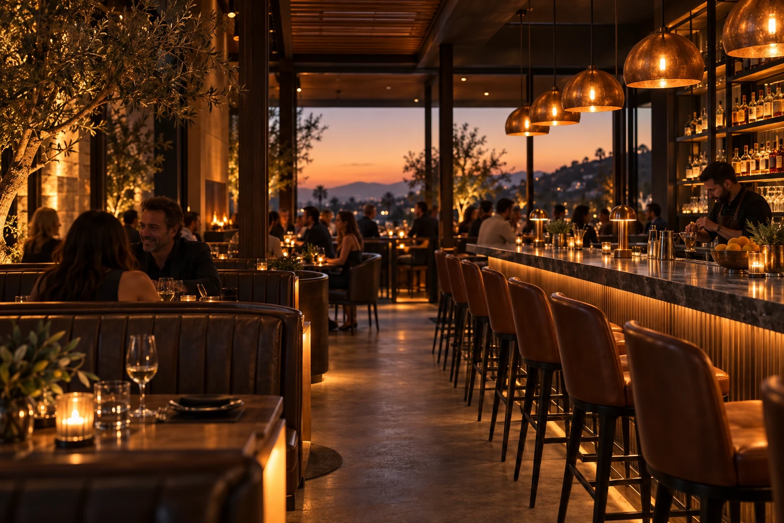 Warm amber lighting and leather booths in a modern bar and grill