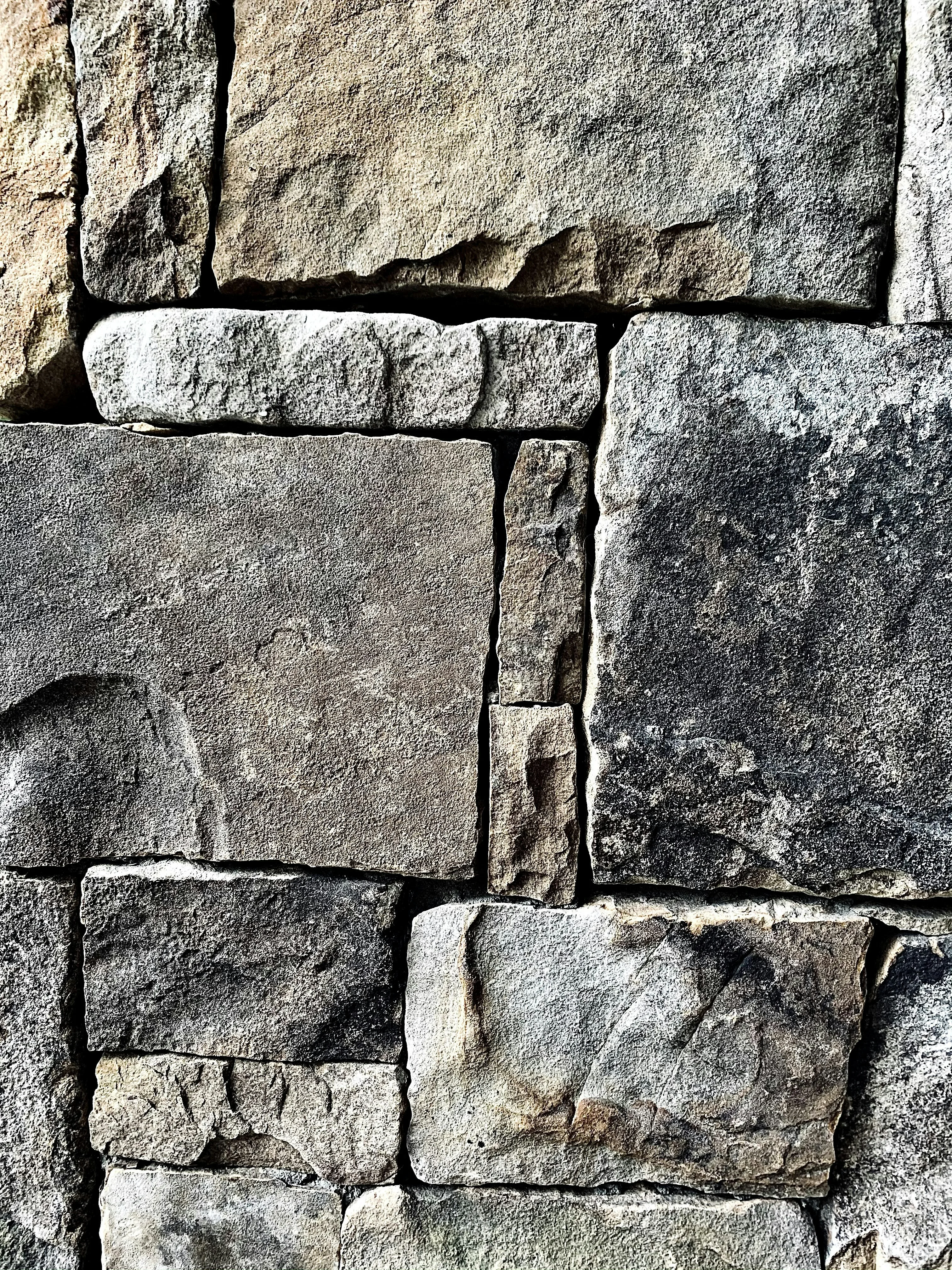 Natural stone masonry wall highlighting exterior craftsmanship